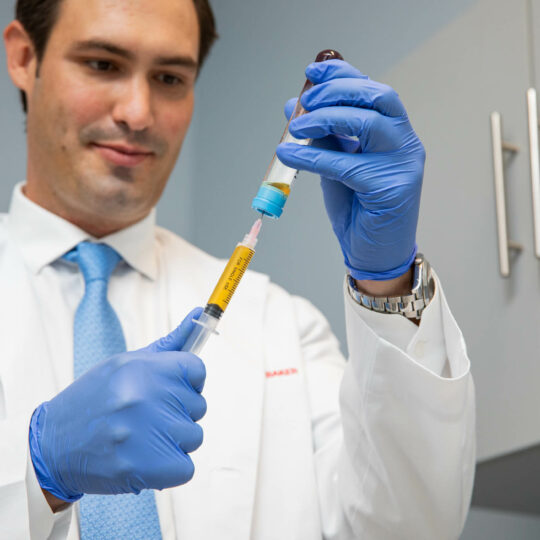 A doctor extracting samples